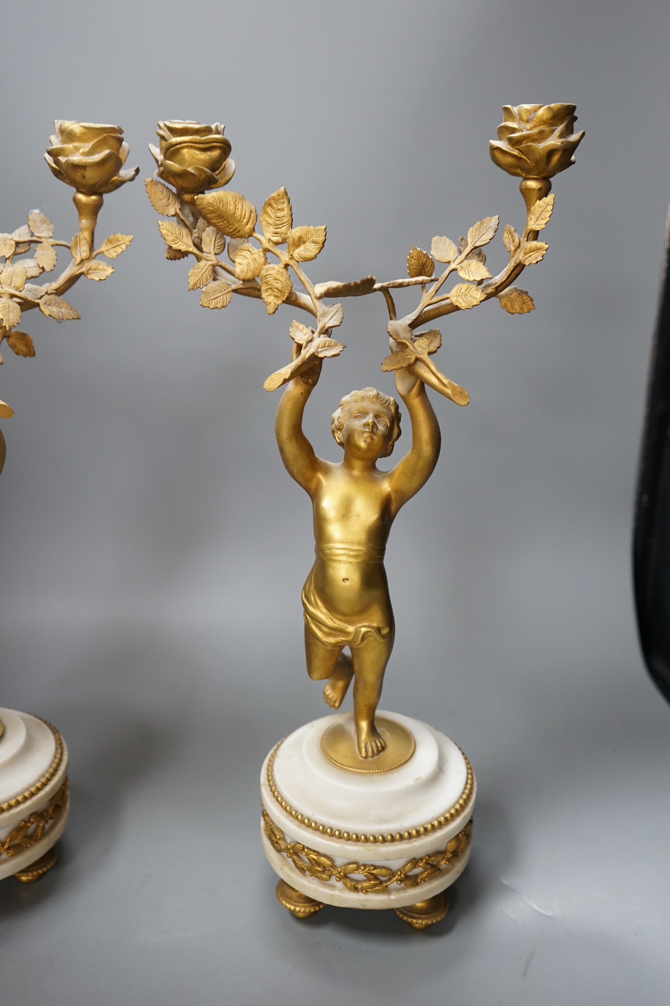 A pair of Louis XVI style ormolu figural candelabra, 41cm